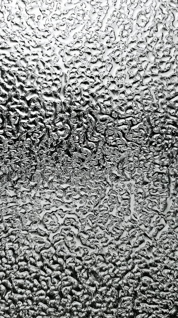 Abstract Rainwater Droplets on Textured Glass