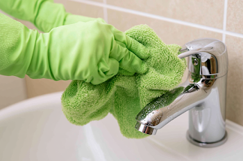Close-Up of Cleaning in a Modern Bathroom