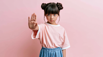 Determined Young Girl in Pastel Pink Studio Portrait
