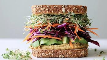 Fresh Vegetarian Sandwich Stacked on Whole Grain Bread