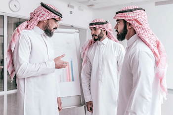 Gulf Businessmen in Modern Office Meeting