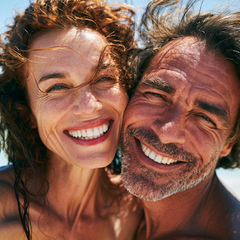 Joyful Beach Selfie of a Middle-Aged Couple