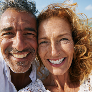 Joyful Selfie of Middle-Aged Hispanic Couple at the Beach