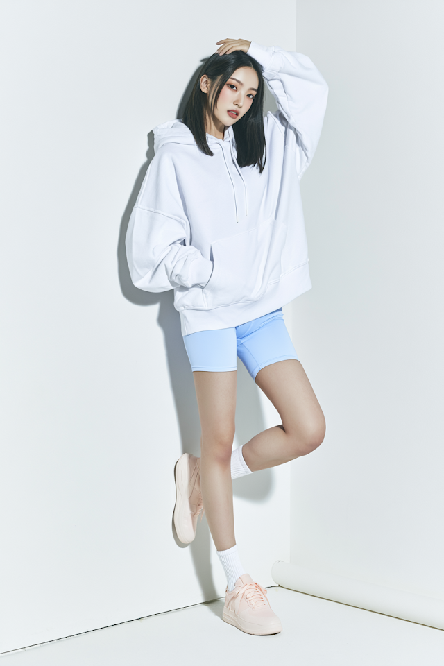 Casual Fashion Portrait of Young East Asian Woman in Oversized Hoodie