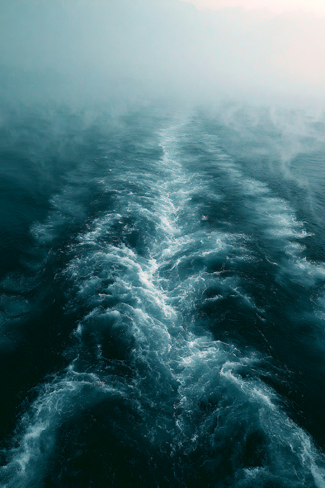 Cinematic Wake of a Car Ferry on a Serene Morning Lake
