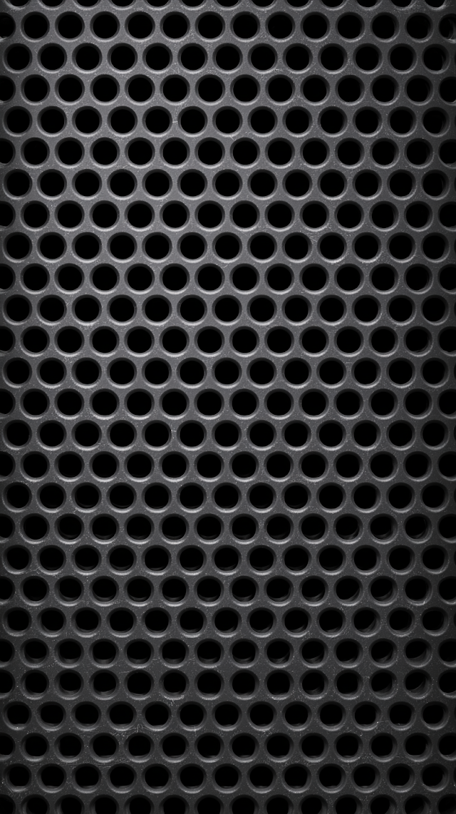 Close-Up Macro of Dark Perforated Metal Grille