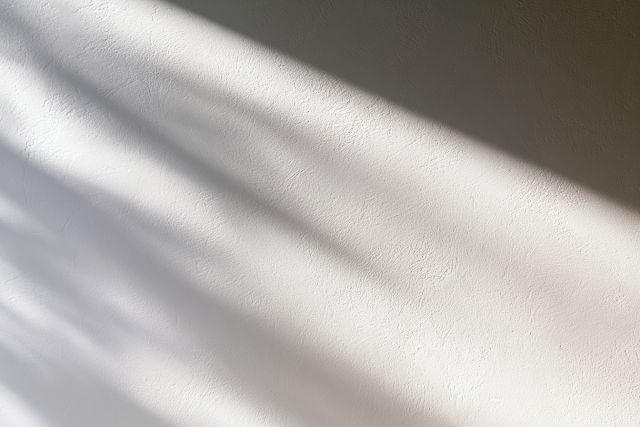 Elegant White Plaster Wall with Subtle Shadows
