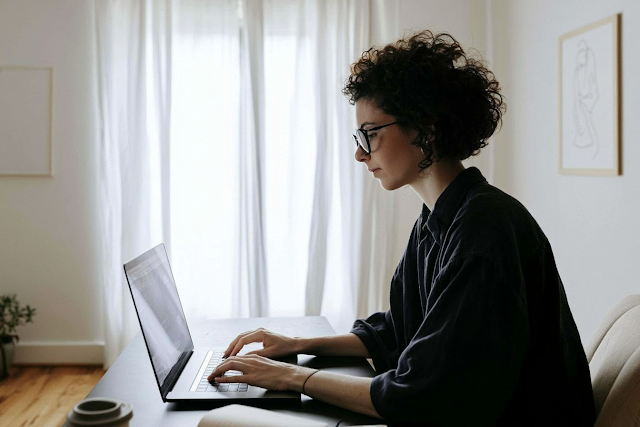 Focused Professional Woman Typing in Modern Home Office