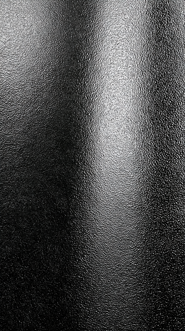 Glossy Black Pebbled Surface Texture