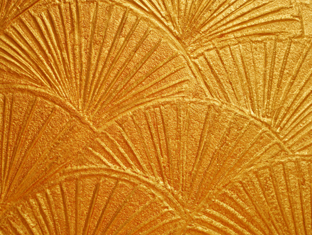 Golden Embossed Wall Texture with Radiant Patterns