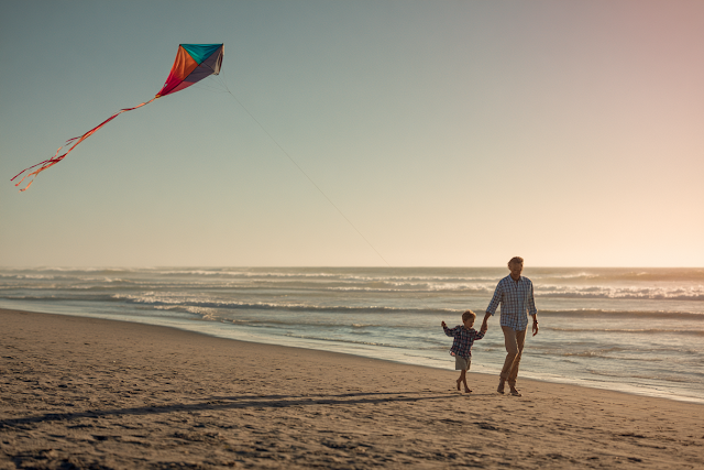 Joyful Father and Son Kite Flying on a Beach