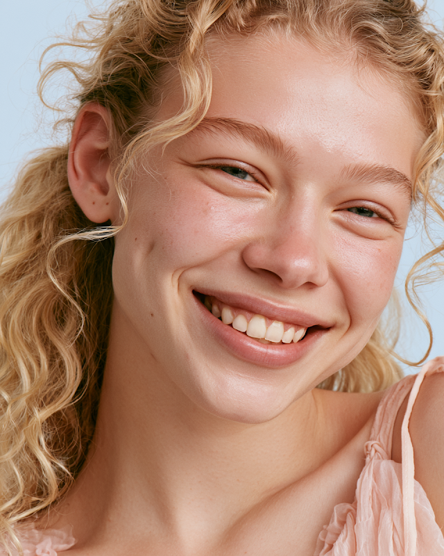 Joyful Young Woman in Summer Dress