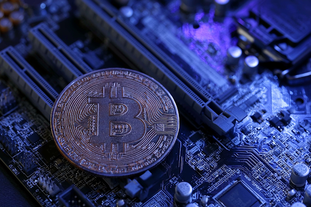 Macro Close-Up of a Bitcoin Coin on a Dark Motherboard