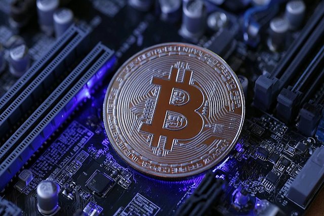 Macro Close-Up of Bitcoin on Motherboard with LED Glow