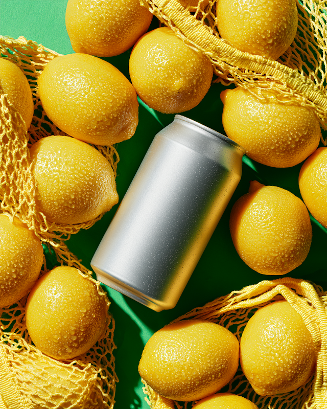 Premium Aluminum Soda Can Mockup with Fresh Lemons
