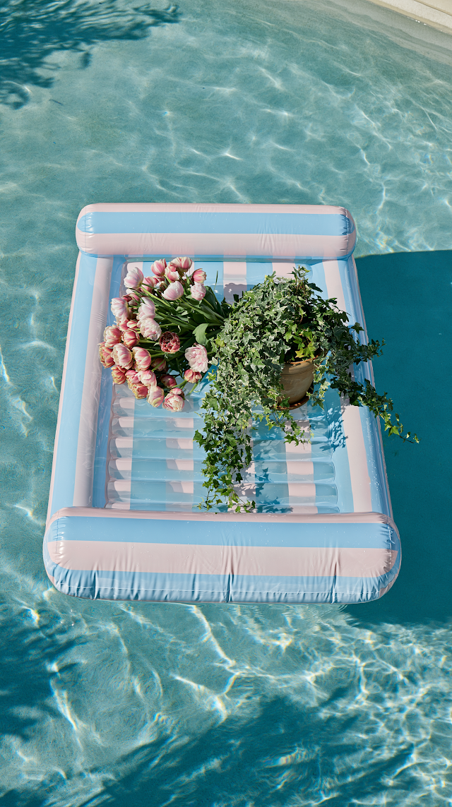 Serene Summer Oasis: Inflatable Mattress in Blue Pool