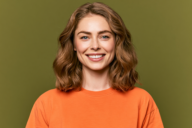 Smiling Young Woman in Bright Orange T-Shirt