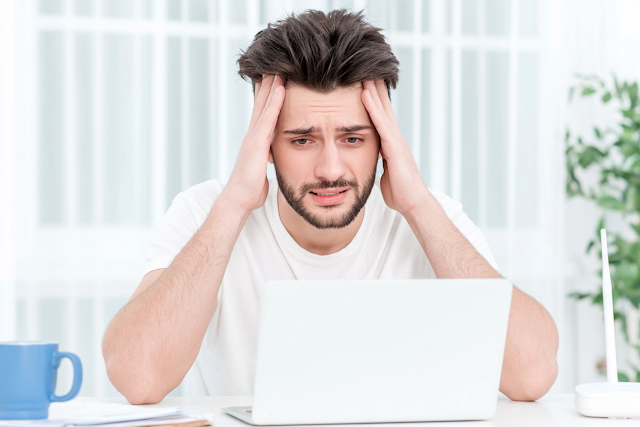 Stressed Young Adult Man Working from Home