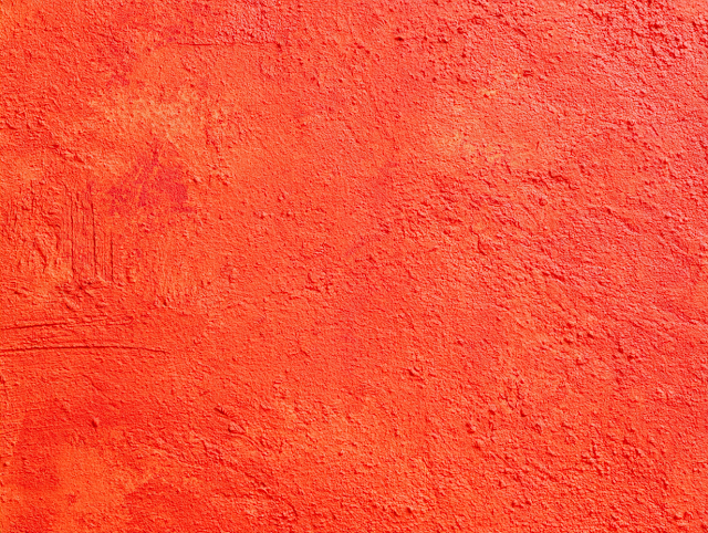 Vivid Red-Orange Stucco Wall Texture